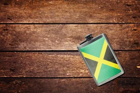 Alcohol flask on the table with flag Stock Photos