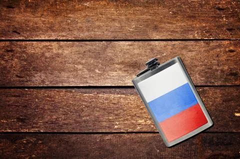 Alcohol flask on the table with flag Foto stock