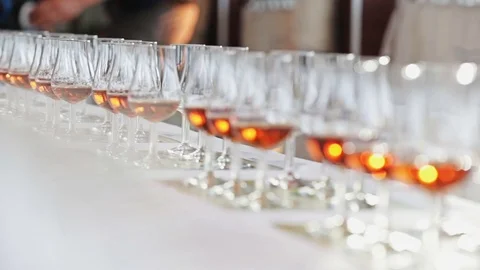 Alcohol glasses lined up in a row Stock Footage 69960109