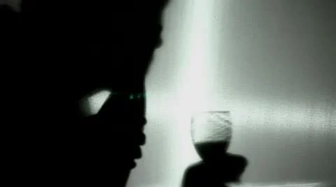 Alcohol intake. A silhouette Stockbeeldmateriaal 10741882