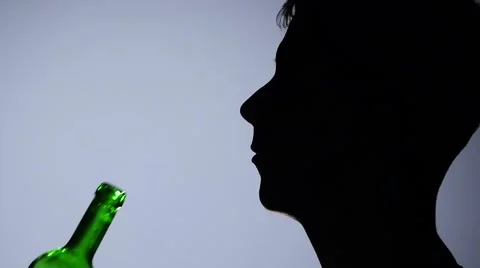 Alcohol. Men drinking red wine with bottle. Grey. Close up. Slow motion Stock Footage 65406879
