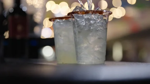Alcohol Poured into Plastic Cups with Ice at Party Bar Stock Footage 315548291