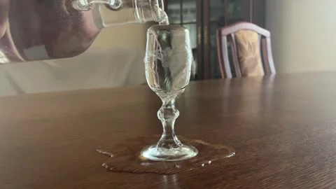 Alcohol spilling from the glass Stock Footage 339204832