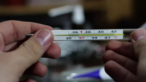 Alcohol thermometer in a man's hand Stock Footage 258796412