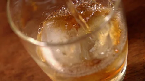 Alcohol (whiskey) pouring in slow motion Stock Footage