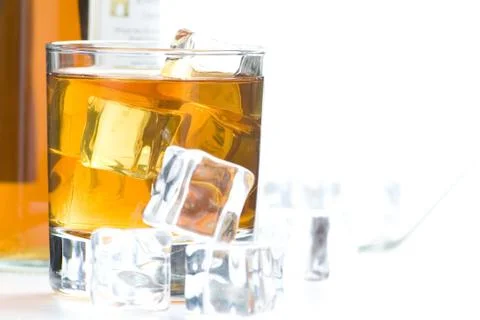 Alcoholic beverage whith ice cubes Stock Photos