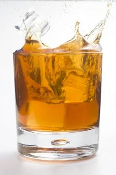 Alcoholic beverage whith ice cubes Stock Photos