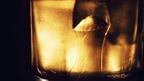 Alcoholic drink with ice cubes in a cold glass 動画素材 81049922