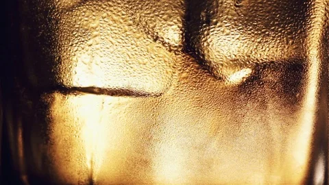 Alcoholic drink with ice cubes in a cold glass Video stock 81050080