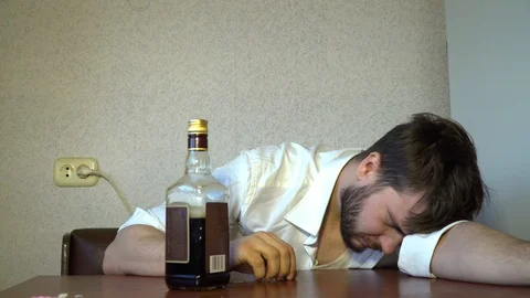 Alcoholic drinks after he has woken up Stock Footage 86044701