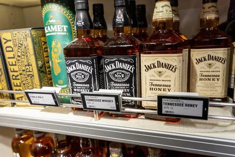 Alcoholic drinks on a shelf in a store. Jack Daniel's whiskey. Copenhagen, .. Stock Photos