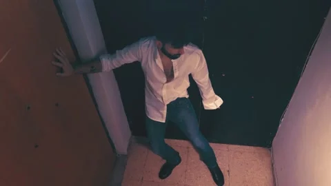 Alcoholic evening - drunk young man barely holds up on the landing 스톡 동영상 197749169
