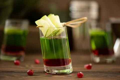 Alcoholic shot with vodka and pomegranate syrup Stock Photos