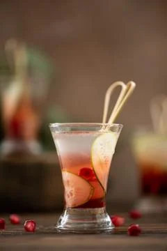 Alcoholic shot with vodka, lemon juice and pomegranate Stock Photos