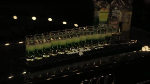 Alcoholic Shots on a Table in a Dark Room Stock Footage 241324206