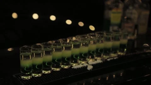 Alcoholic Shots on a Table in a Dark Room Stock Footage 241324207