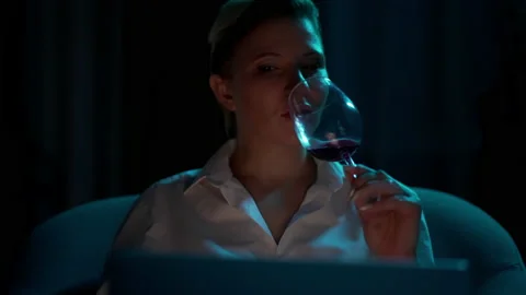 Alcoholism concept. Drinking wine every day in evening. Middle-aged Woman Video stock 157764590