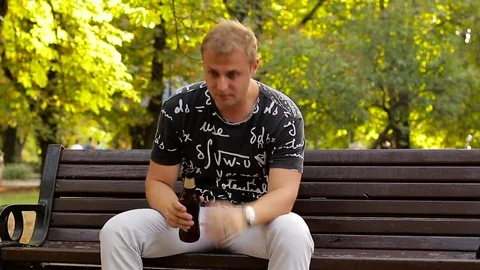 Alcoholism in a public place. A drunk ma... | Stock Video | Pond5