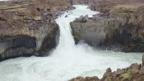 Aldeyjarfoss waterfall, fall in canyon with twisted basalt columns, arc shot Stock Footage 138709147