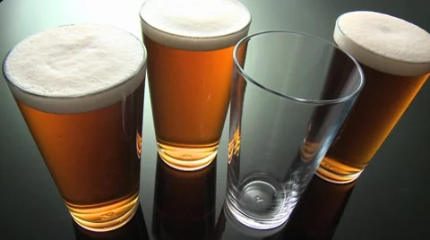 Ale, three full glasses and a glass being poured Stock Footage 8574560