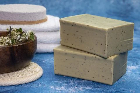 Aleppo soap and dray Laurus nobilis flower in a wooden plate . Stock Photos