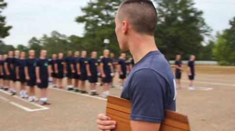 Alert Academy students run to mat to begin pushups Stock Footage 39215676