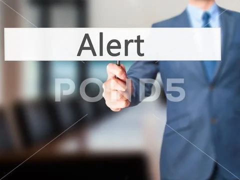 Alert - Businessman hand holding sign Stock Photos