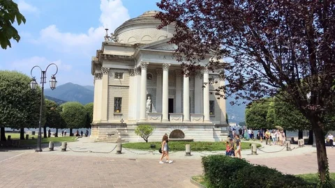 Alessandro volta temple building in como with tourists walking Stock Footage 118649006