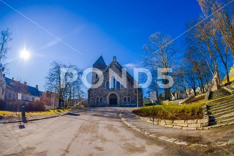 ALESUND, NORWAY - APRIL 04, 2018: Outdoor view of Alesund church, with a blue Stock Photos