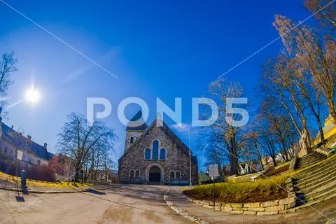 ALESUND, NORWAY - APRIL 04, 2018: Outdoor view of Alesund church, with a blue Stock Photos