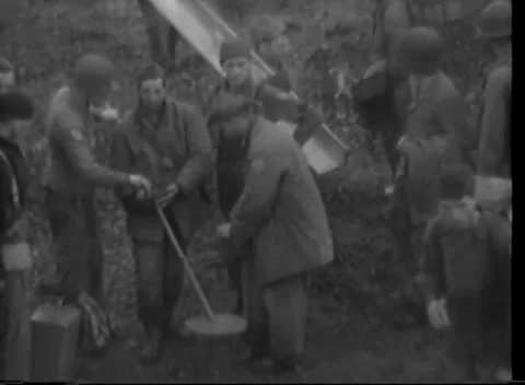 ALEUTIAN ISLANDS - 1943: Kiska beachhead — close view of men with shovels Stock-Footage 343135553