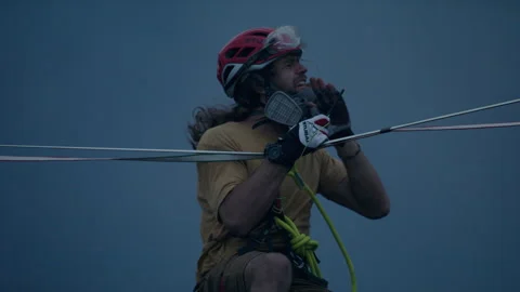 Alex Schulz gets ready to walk slackline over active volcano 스톡 동영상 276660430