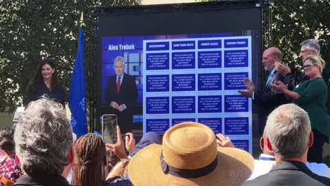 Alex Trebek postage stamp debut Stock Footage 284036739