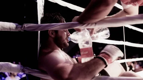 Alexander Stolyarov resting in corner between rounds of MMA fight Stock Footage 56290951
