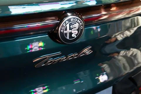Alfa Romeo Tonale PHEV rear emblem and script lettering close-up at ECAR Sh.. Stock Photos
