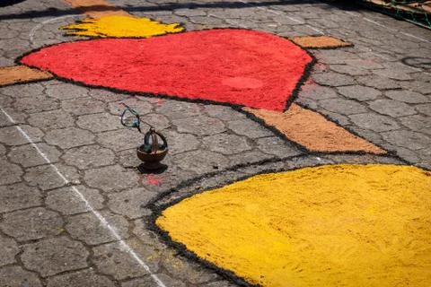Alfombra, sawdust carpet with heart and incense bowl on street made for Seman Stock Photos