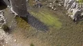 Algae and rocks at Santa Luzia River Wild Water Beach - Mértola 4k or 4k+ Resolution
