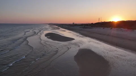 ALGARVE BEACH SUNSET aerial pull back over beach Stock Footage 286701262