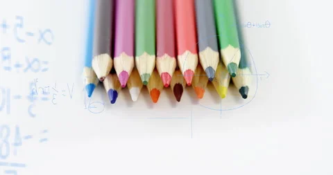 Algebraic expression appearing over colored pencils, diagrams morphing showing Stock Footage 316191059