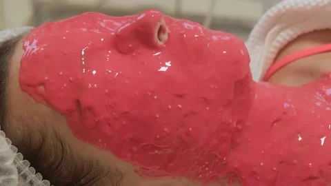 Alginate mask on woman's face, close-up. Stockbeeldmateriaal 202323435