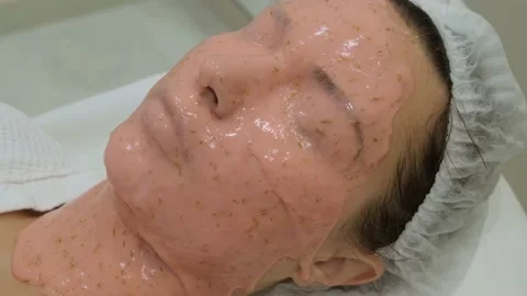 Alginate mask on woman's face, close-up. Stockbeeldmateriaal 218088310