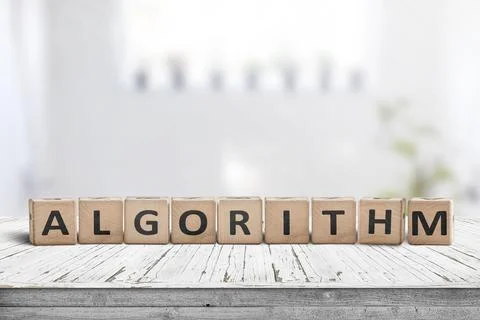 Algorithm word on a wooden sign made of blocks in a bright room Stock Photos