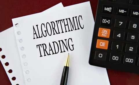 ALGORITHMIC TRADING - words on a white sheet with a calculator and pen in the Stock Photos