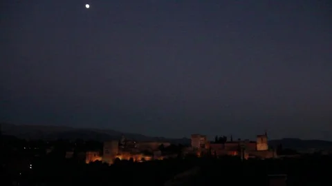 Alhambra during the night, roofs in foreground, moon Stock Footage 78037767