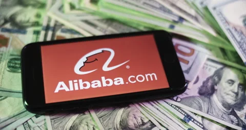 Alibaba Logo on iphone surrounded by $100 Bills. Alibaba Profits Layout. Stock Footage 169007833