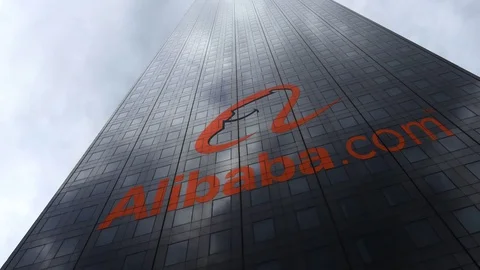 Alibaba.com logo on a skyscraper facade reflecting clouds, time lapse. Editorial Video stock 81076010