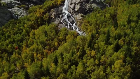 Alibek mountain waterfall in the autumn forest, near the village of Dombai Stock Footage 258317429
