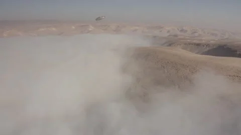 Alien desert world with ufo's Fleet and mist clouds, aerial view Stock Footage 157560166
