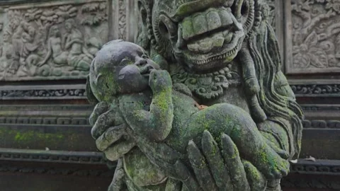 Alien statue holding a baby in the  Monkey Forest. Ubud, Bali, Indonesia. Video stock 271502811