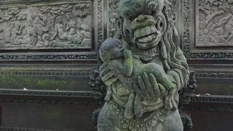 Alien statue holding a baby in the  Monkey Forest. Ubud, Bali, Indonesia. Video stock 271572741
